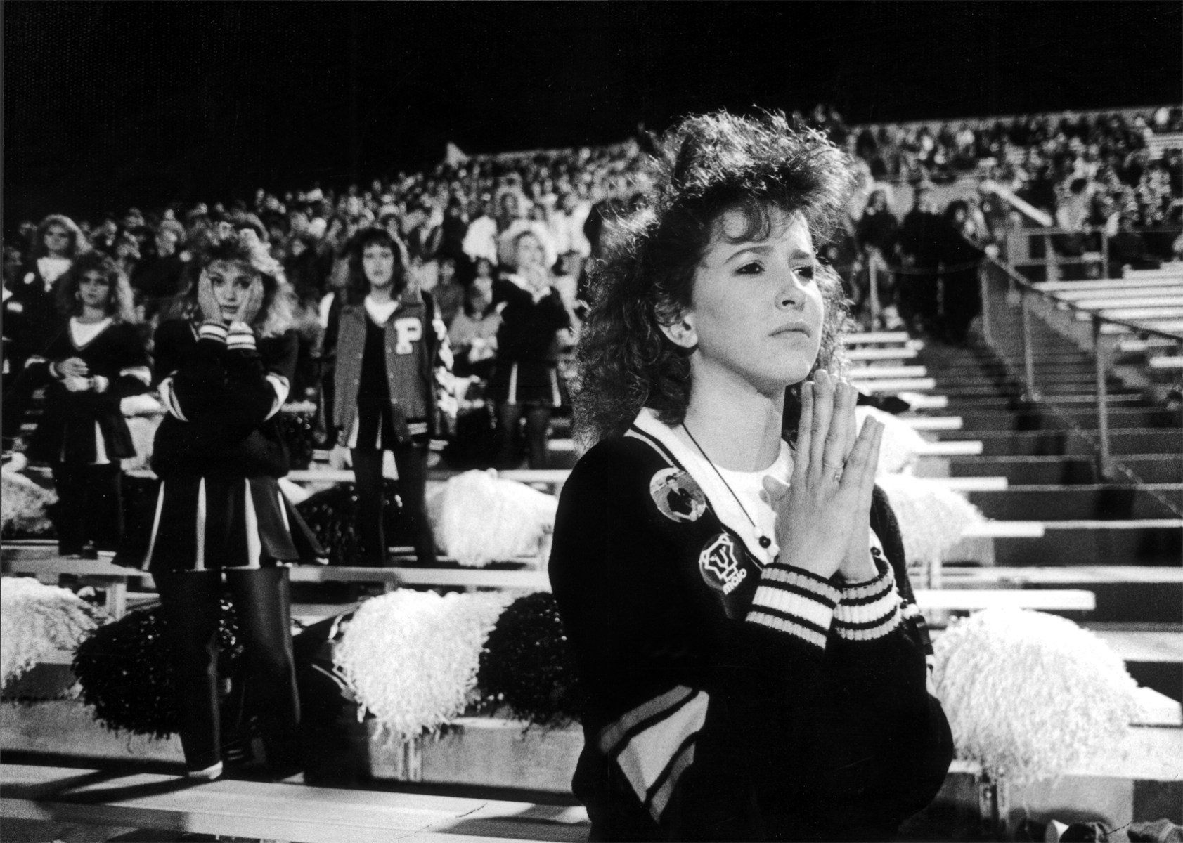 Pepettes Robbie Freeman (left) and March Bryant (right) pray for a touchdown in the final seconds.<br><br>“The hair was crazy out there then,” Clark says. “This was against Midland Lee. They lost and Midland Lee was their arch-rival. There's Odessa and Midland. They're both kind of oil towns, but they always said that Odessa is where you went to raise hell and Midland is where you went to raise a family.”