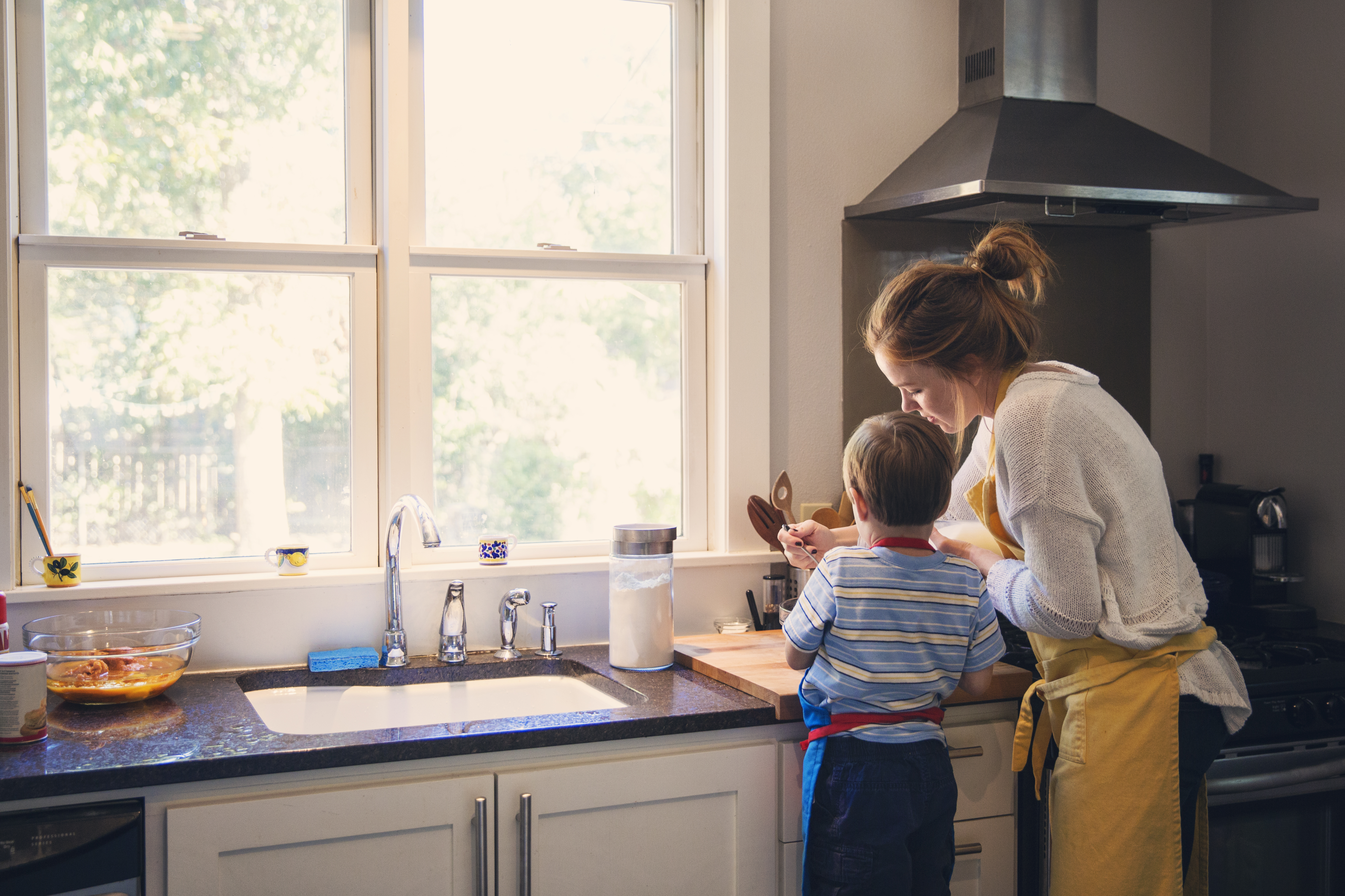 child cooking with parent