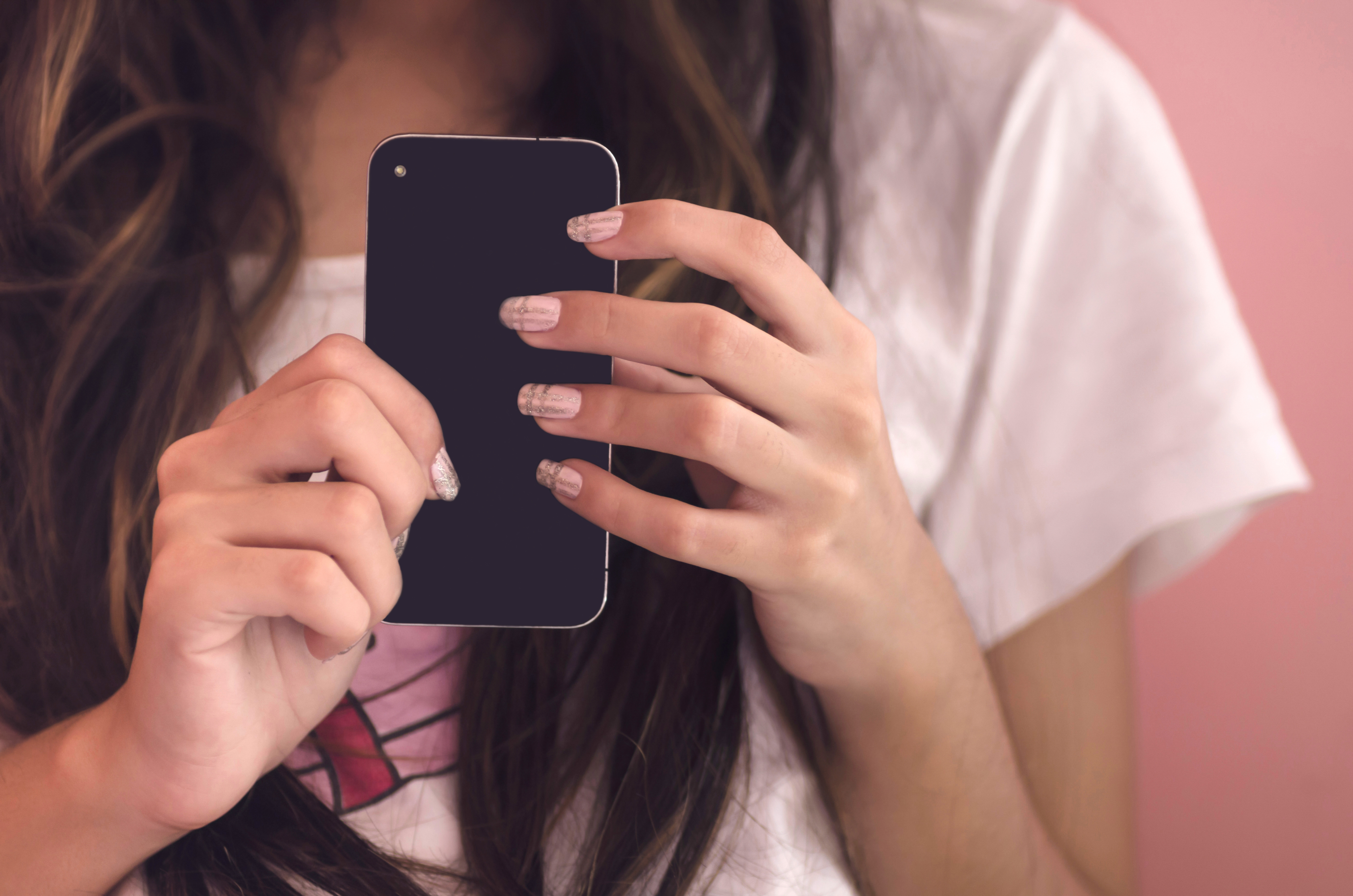 young woman holding phone