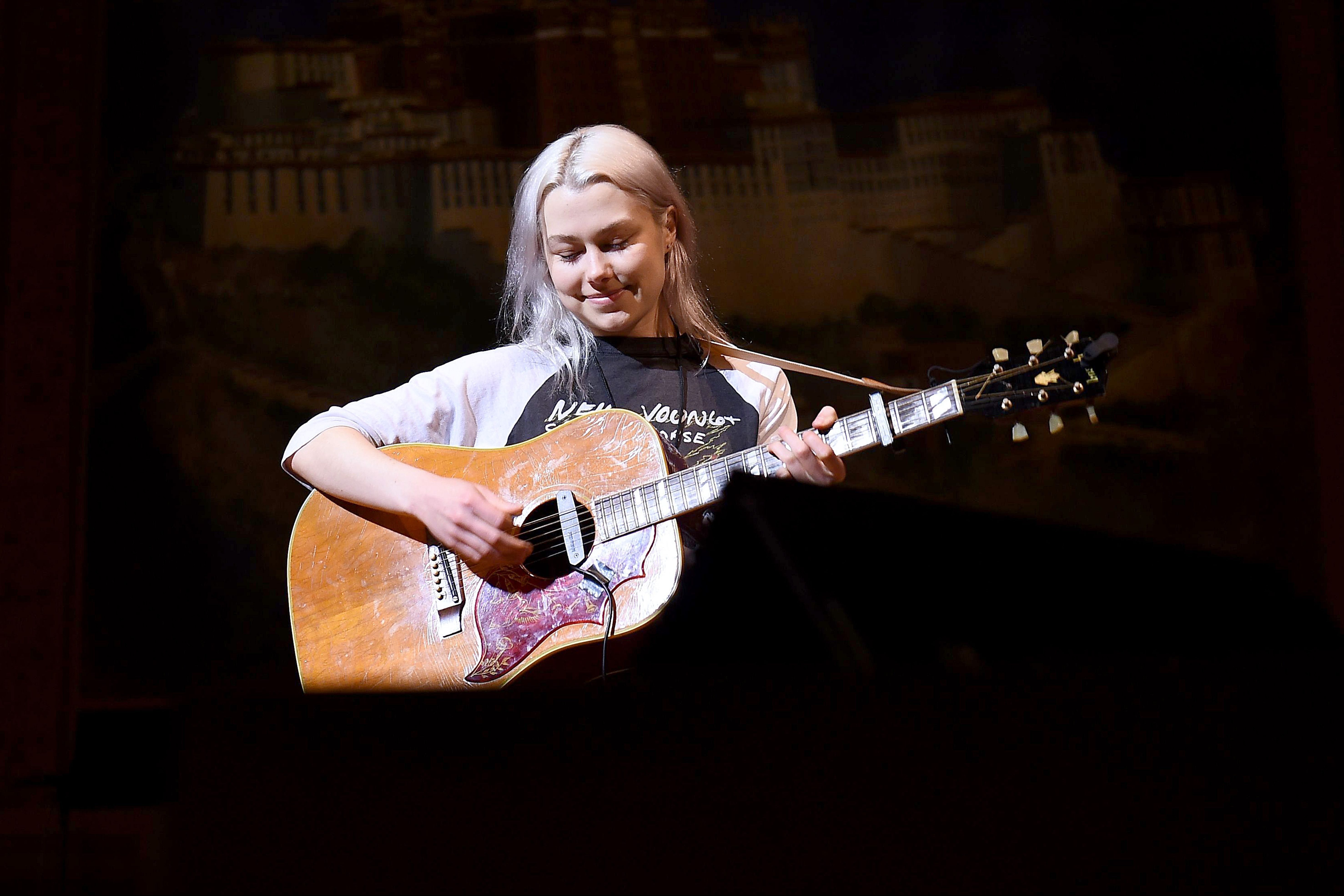 phoebe bridgers playing the guitar