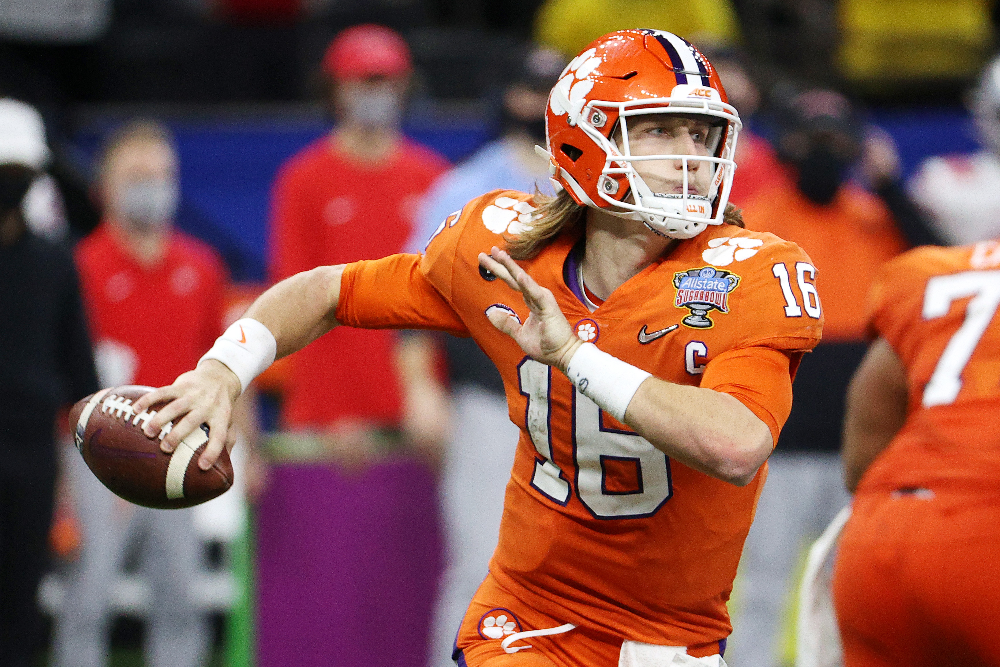 Trevor Lawrence of the Clemson Tigers looks to pass in the second half against the Ohio State Buckeyes during the College Football Playoff semifinal game at the Allstate Sugar Bowl at Mercedes-Benz Superdome on January 01, 2021 in New Orleans, Louisiana.