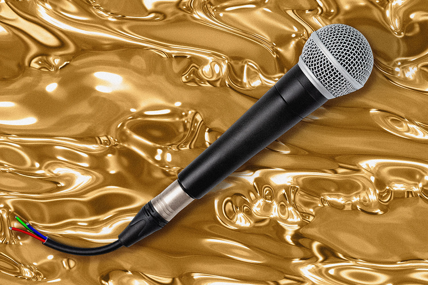 An unplugged microphone sits in front of a gold background