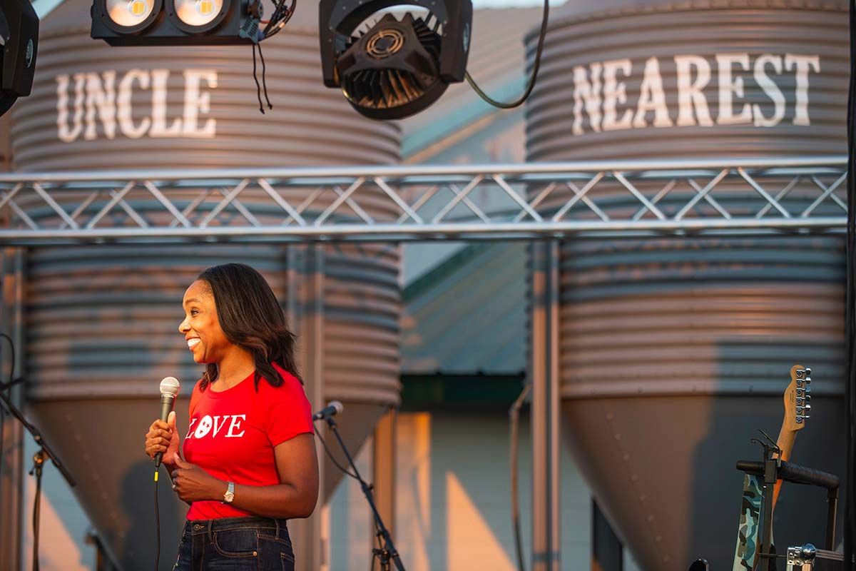 Uncle Nearest CEO Fawn Weaver speaks to guests at the distillery's opening celebration in 2019