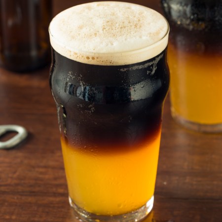 Irish Layered Black and Tan Beer with Lager and Stout in a glass on a bar