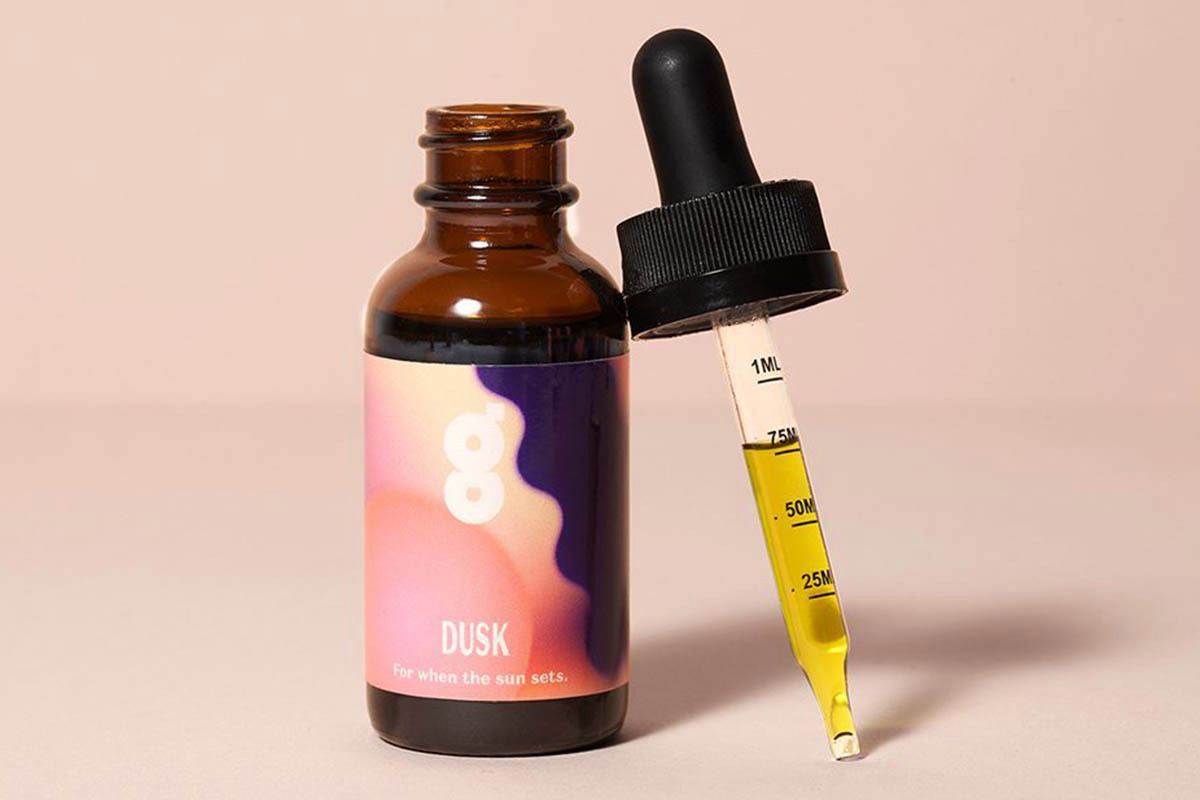 An open bottle of Gossamer Dusk, a CBD sleeping aid and tincture