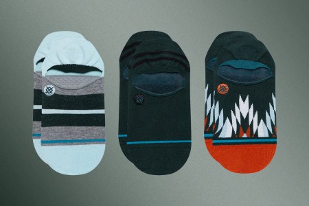 Three pairs of Stance Classic No Show Socks in blue, turquoise and a pattern