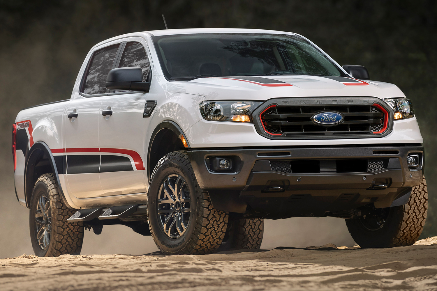 A white 2021 Ford Ranger Tremor off-road pickup truck sitting on dirt