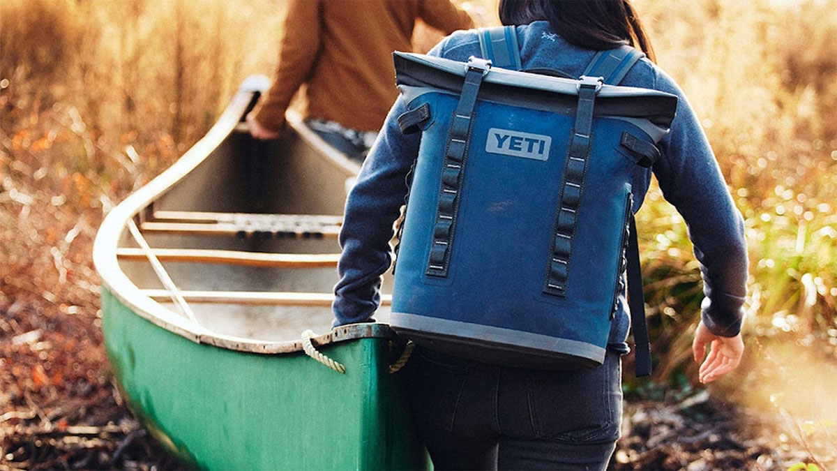 The Icemule Boss, Yeti Hopper M20 and Stoic Hybrid Backpack Cooler on a grey and white textured background.