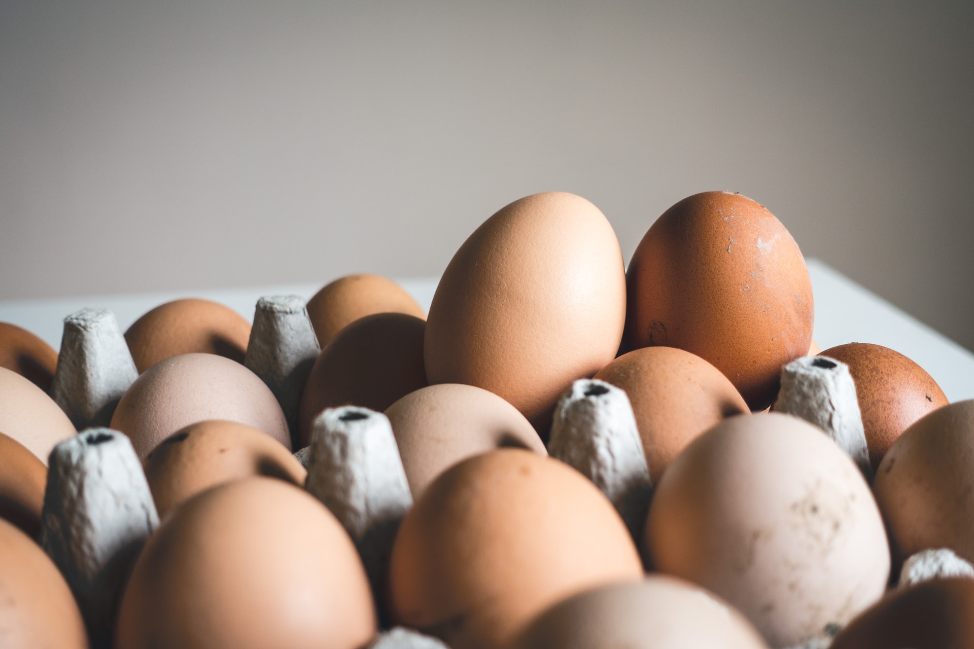 Eggs variety of white and brown eggs in a carton