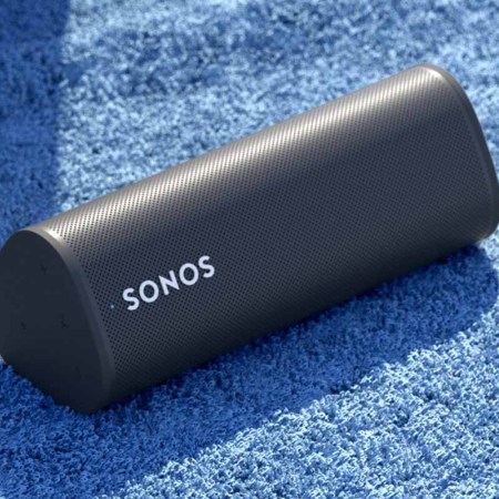 The new Sonos Roam lying on a blanket outside. The portable speaker goes is currently up for preorder.