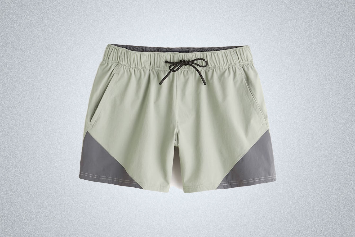 a pair of nylon shorts on a grey background