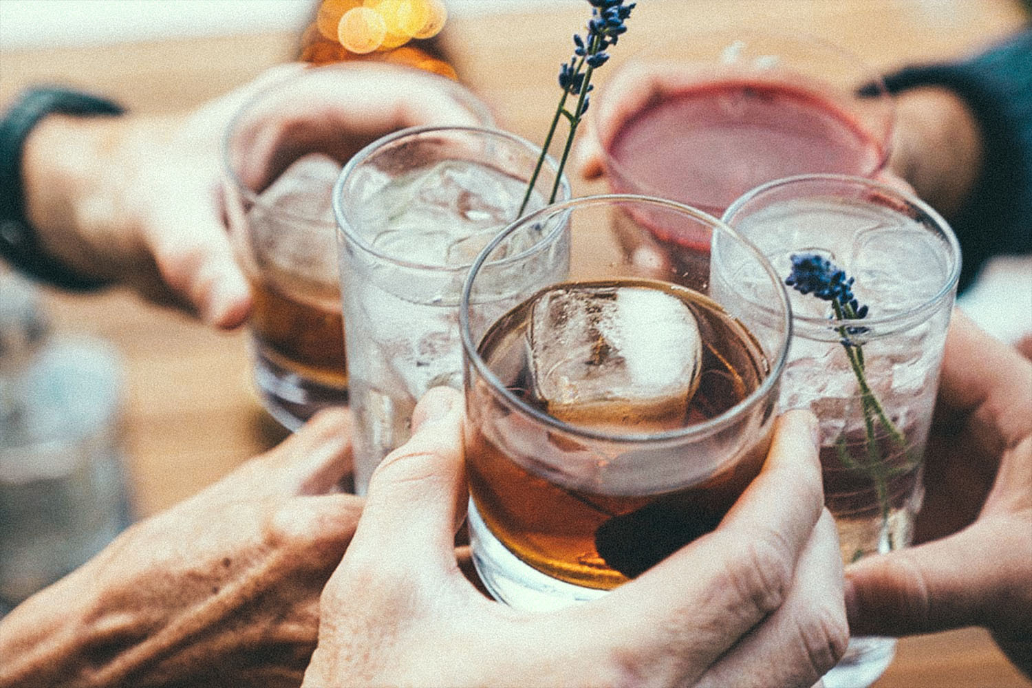 Five people holding various non-alcoholic drinks. These non-alcoholic drinks (via Wilderton) may cost as much as your boozy tipple