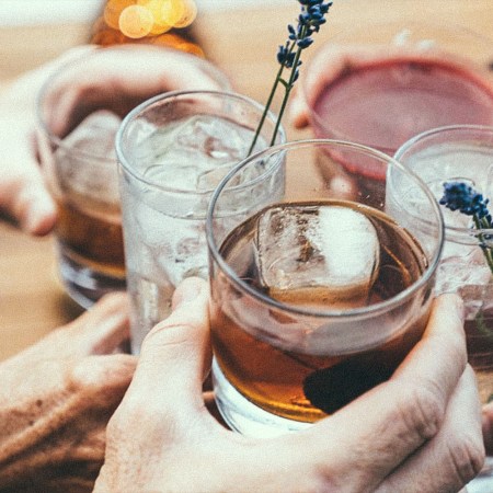 Five people holding various non-alcoholic drinks. These non-alcoholic drinks (via Wilderton) may cost as much as your boozy tipple