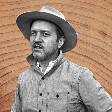 Best Made Co. founder Peter Buchanan-Smith in black and white on a wood grain background