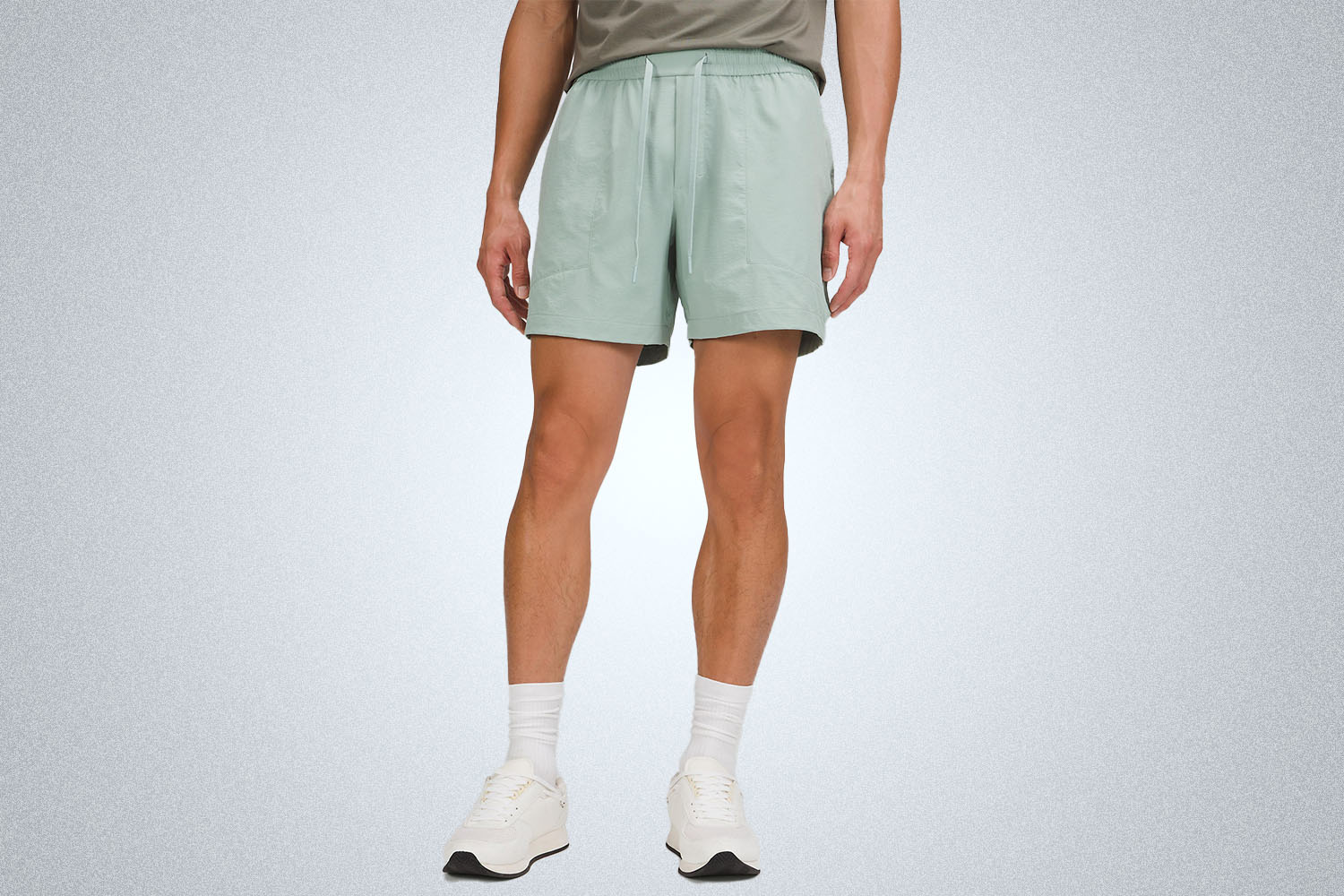 a pair of nylon shorts on a grey background