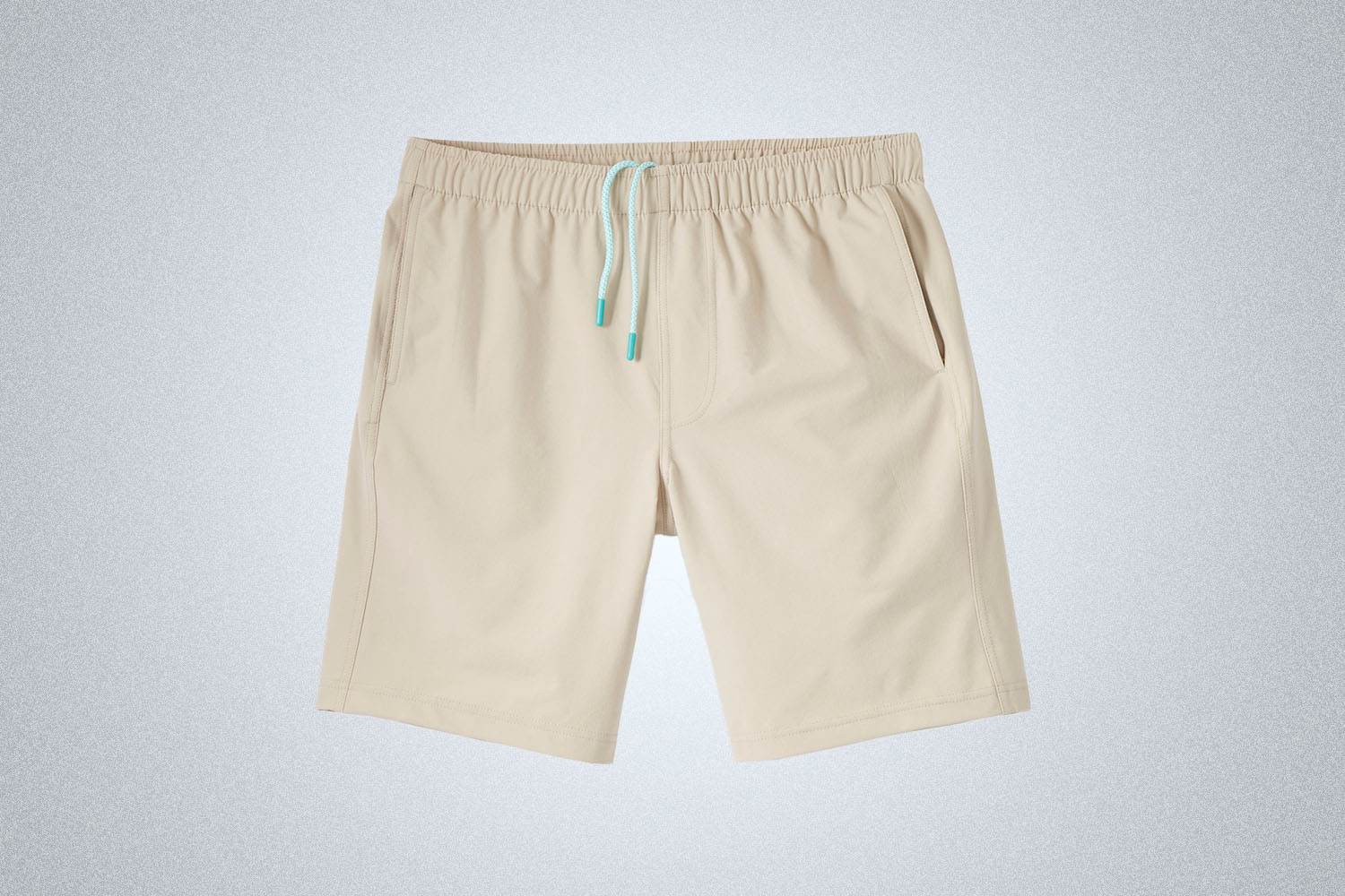 a pair of nylon shorts on a grey background