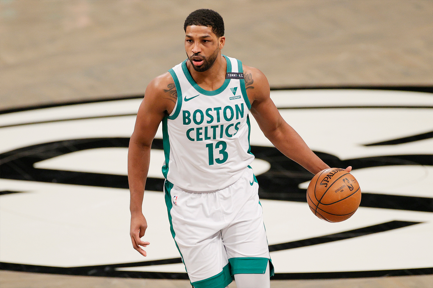 Tristan Thompson #13 of the Boston Celtics dribbles during the first half against the Brooklyn Nets