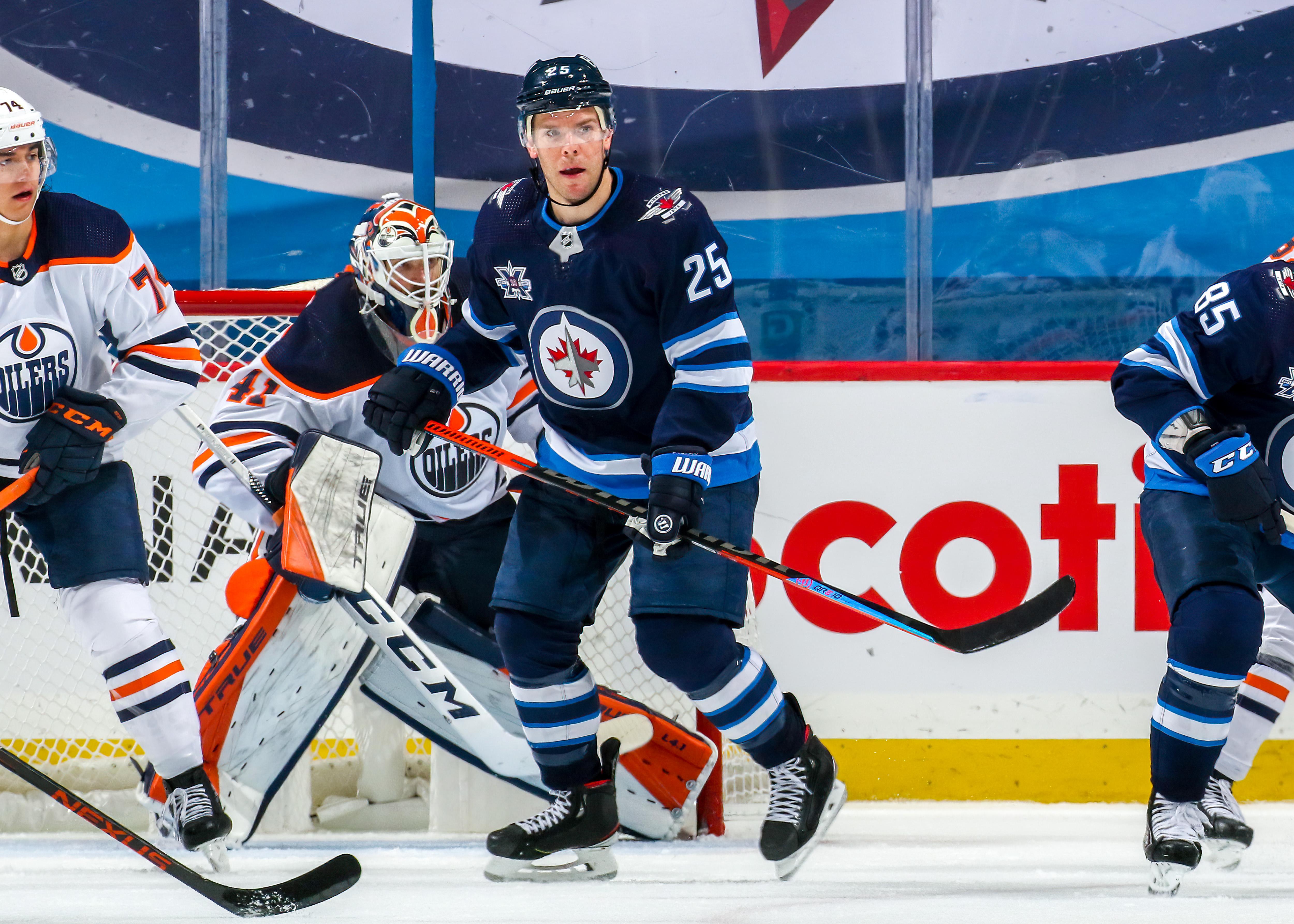 Paul Stastny #25 of the Winnipeg Jets keeps an eye on the play during third period action against the Edmonton Oilers at Bell MTS Place on April 17, 2021