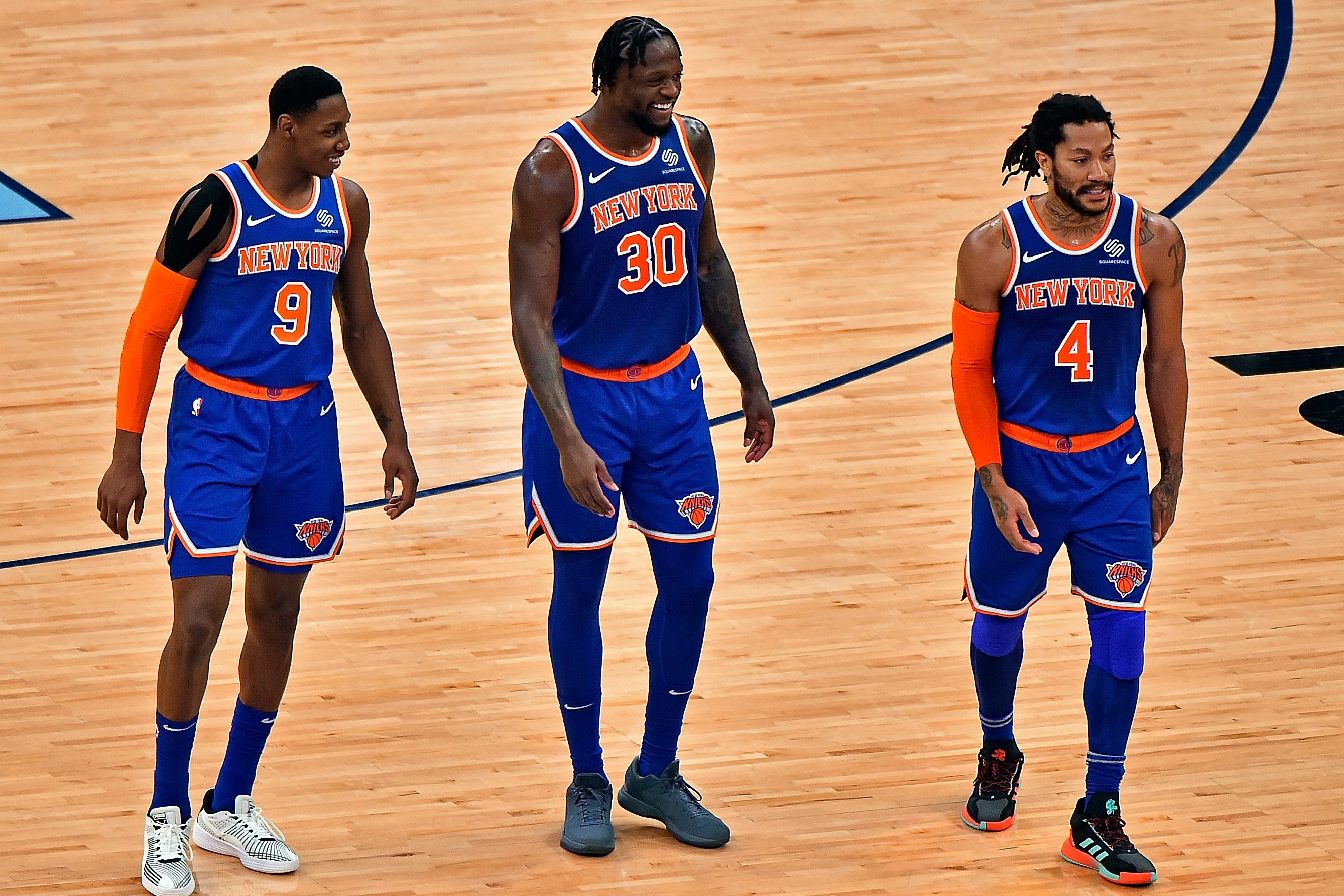 RJ Barrett, Julius Randle and Derrick Rose of the New York Knicks on the court