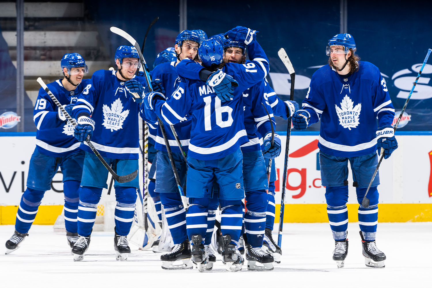 Mitchell Marner #16 and John Tavares #91 of the Toronto Maple Leafs hug after their team defeated the Vancouver Canucks at the Scotiabank Arena on April 29, 2021