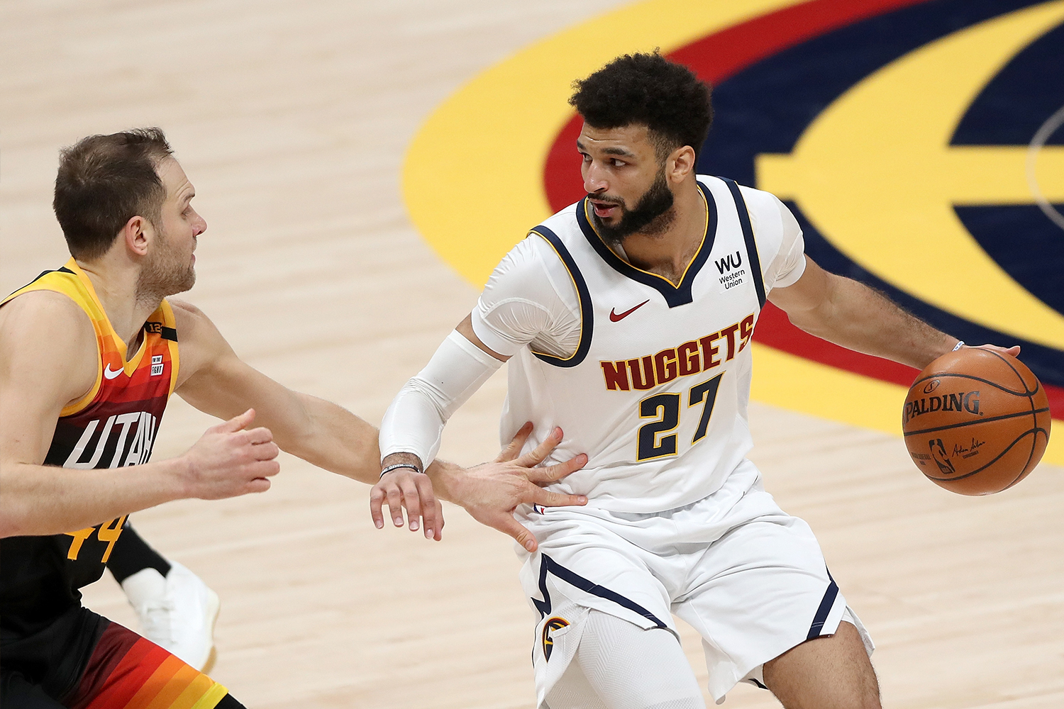 Jamal Murray #27 of the Denver Nuggets drives against Bojan Bogdanovic #44 of the Utah Jazz