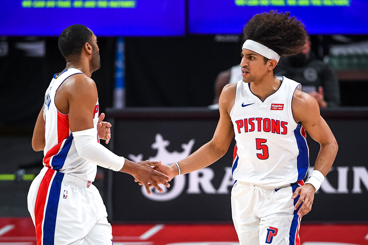 Wayne Ellington #8 of the Detroit Pistons high fives Frank Jackson #5 of the Detroit Pistons during the fourth quarter of the NBA game against the Memphis Grizzlies