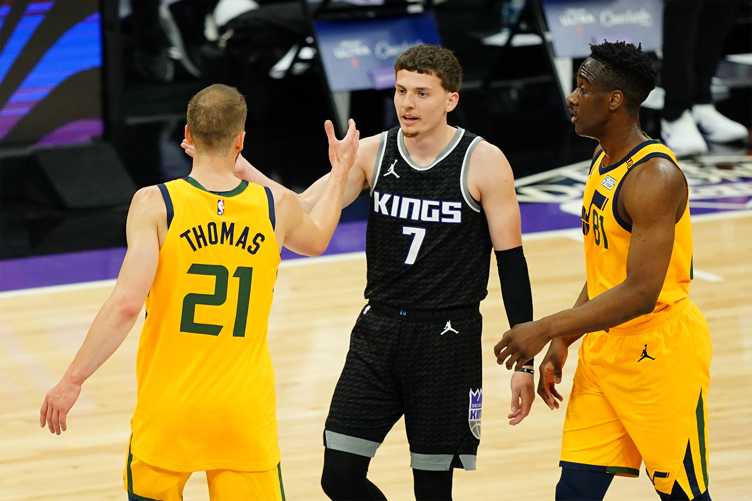 Matt Thomas #21 of the Utah Jazz and Kyle Guy #7 of the Sacramento Kings