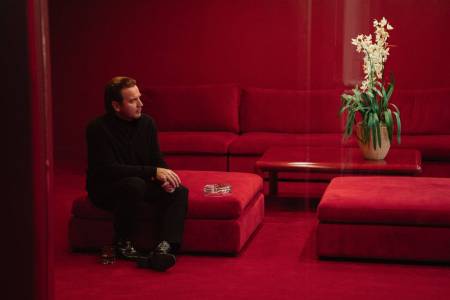 Halston (portrayed by Ewan MacGregor) admires one of his precious orchids in the new Netflix series on his life and career