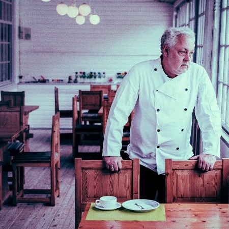 A chef looks out within an empty restaurant. Hospitality staffing remains an issue during the latter stage of the Covid-19 pandemic.