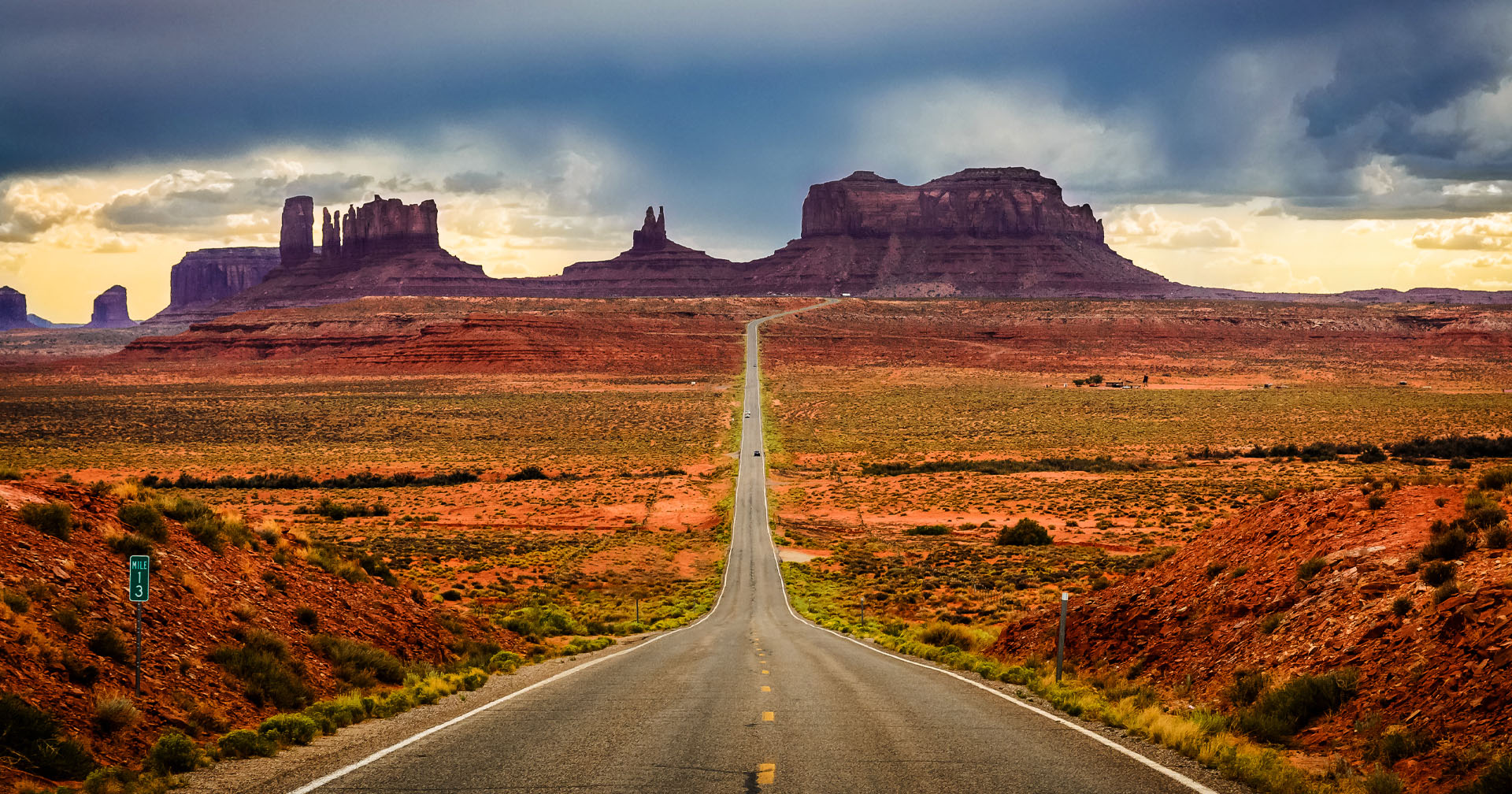 Highway 163 through Monument Valley is one of the most scenic drives and road trips in America, as evidenced by this view of the towering sandstone buttes in the Navajo Valley Park in Arizona.