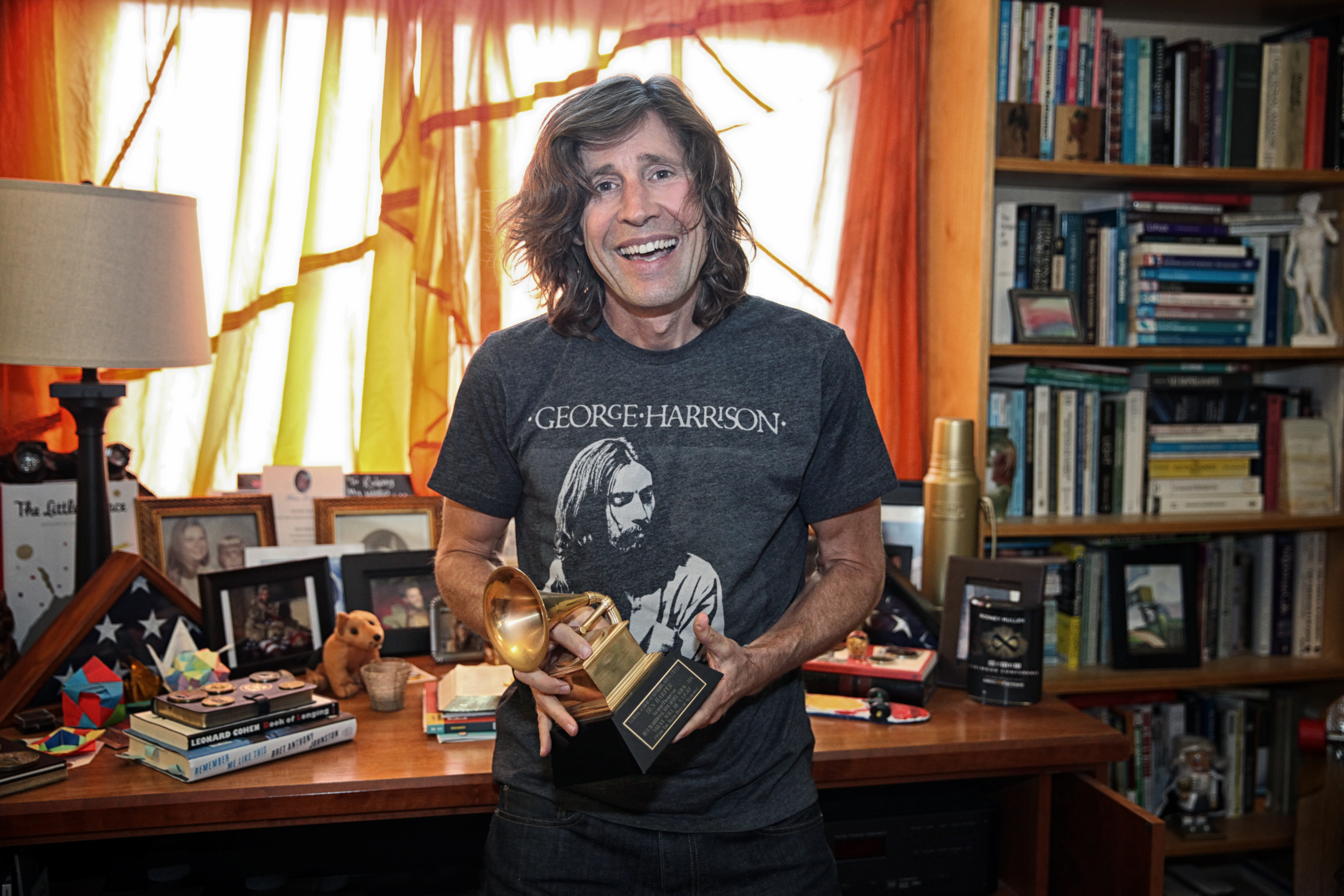 Rodney Mullen showing a Grammy given to him by Ben Harper