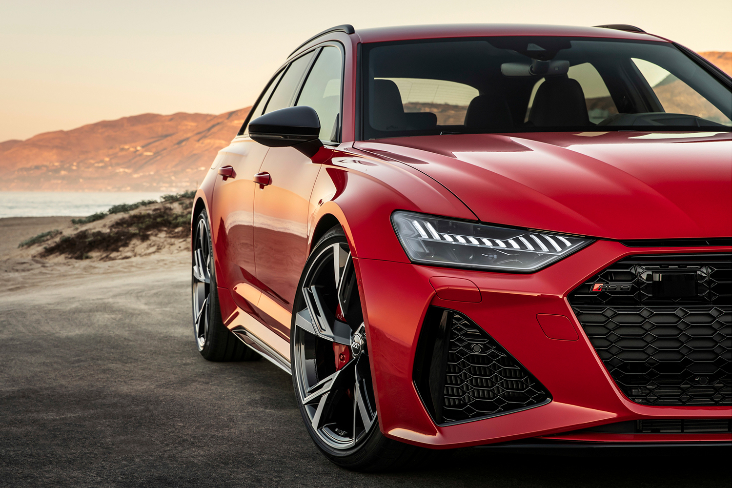 A close-up of a red Audi RS 6 Avant, a high-powered station wagon that is now available in the United States