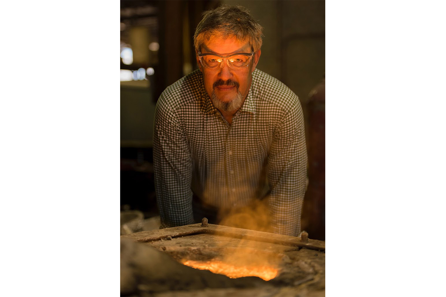 Dennis Powell, the founder of Butter Pat Industries, while his cast iron pans are being made