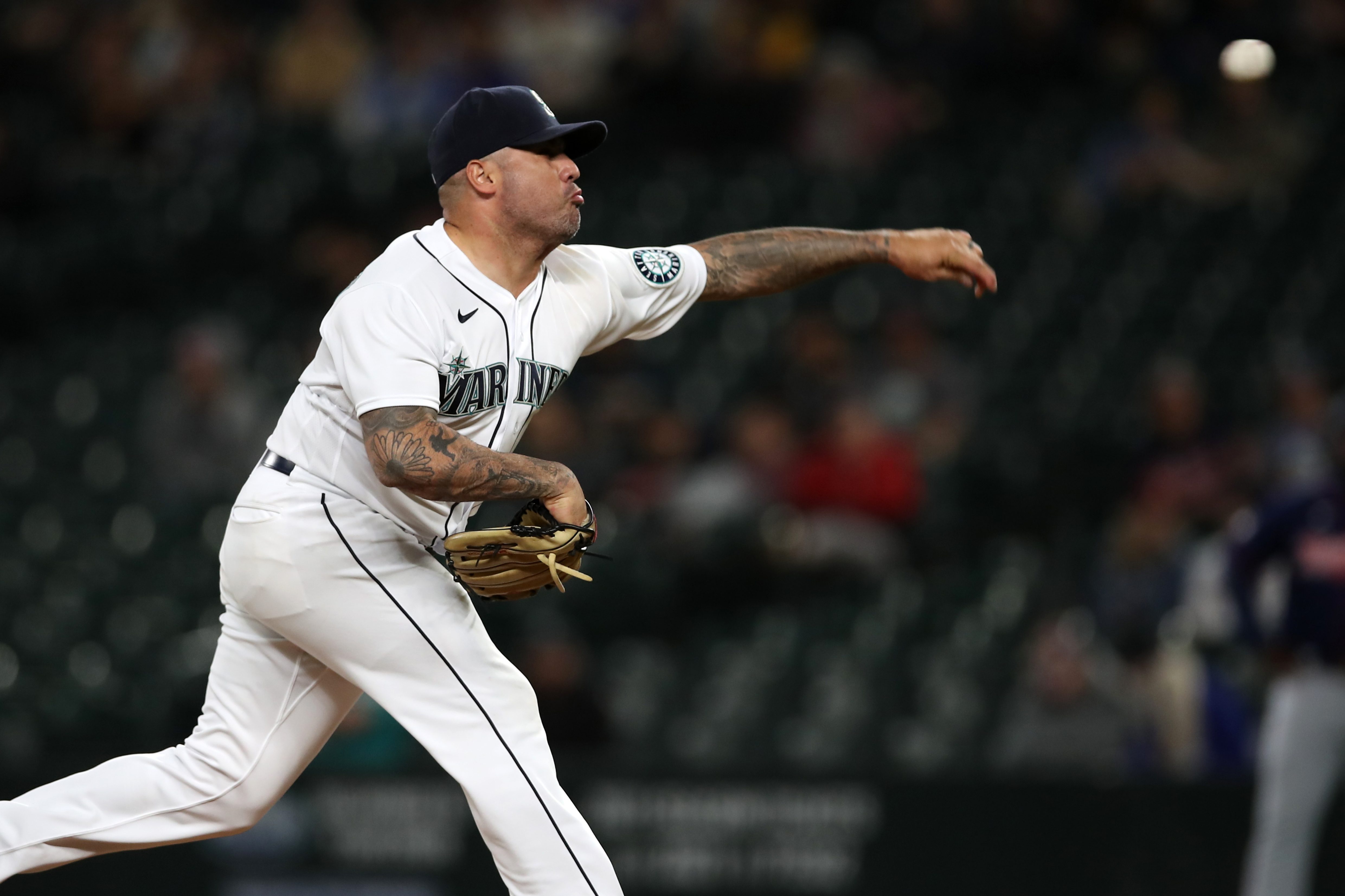 Héctor Santiago of the Seattle Mariners pitching a ball. The pitcher was the first player ejected in MLB's sticky substance crackdown.