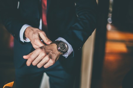 Well Dressed Man putting his wrist watch