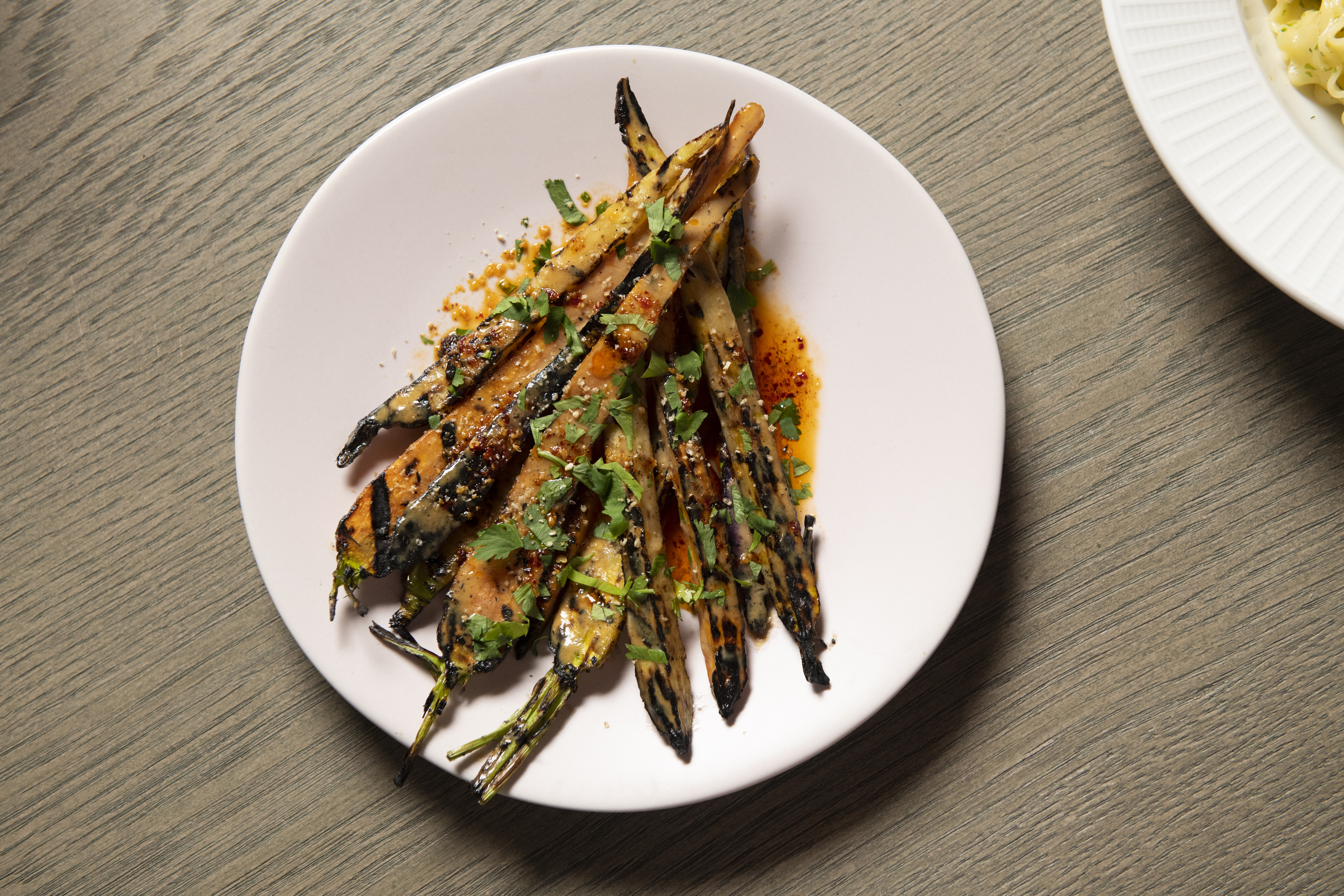 Chef Christine Lau’s Grilled Carrots, Sesame Sauce, Chili Oil, Cilantro