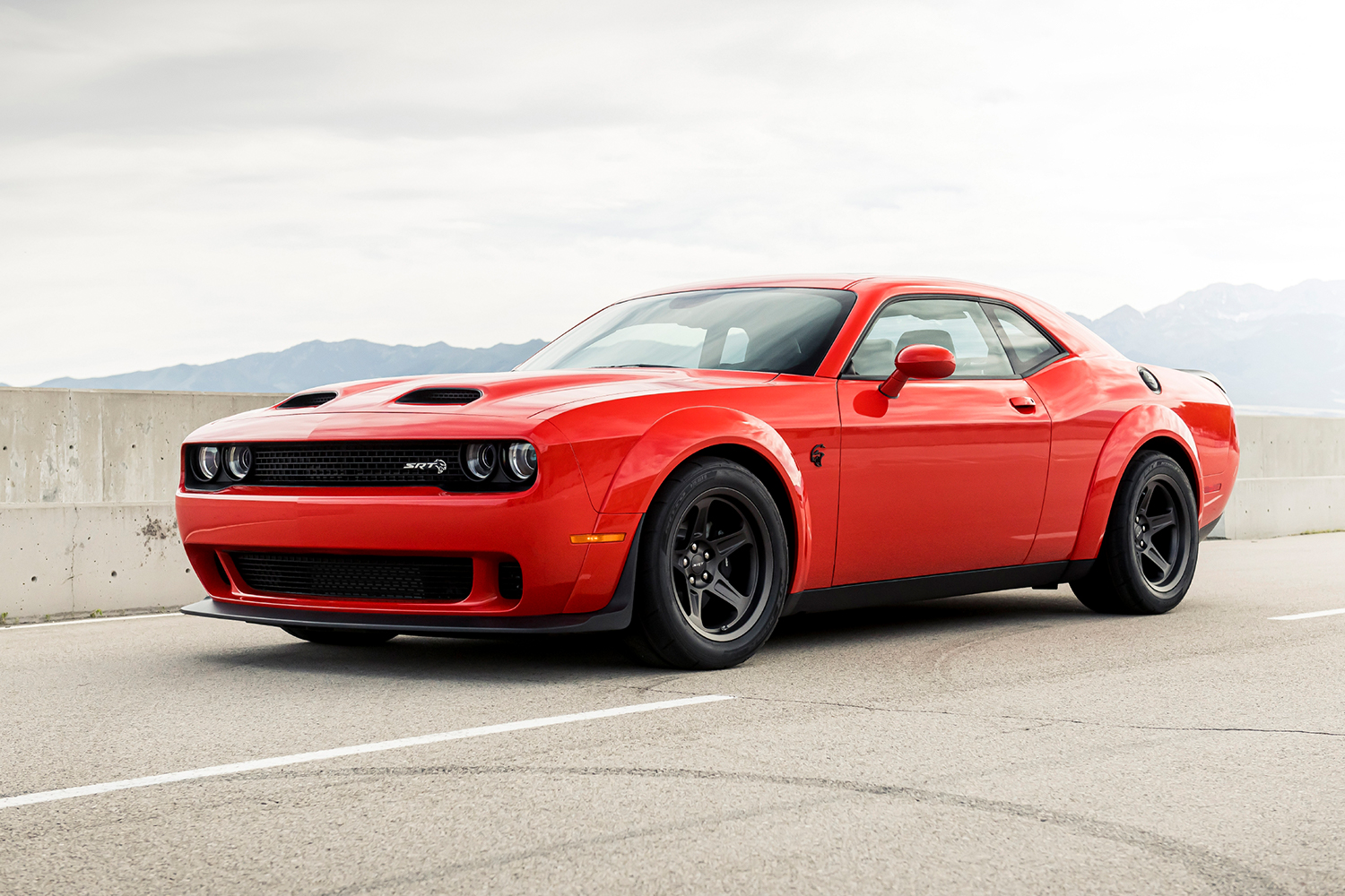 The 2021 Dodge Challenger SRT Hellcat in orange. This is a muscle car, but can the new electric Dodge be one?