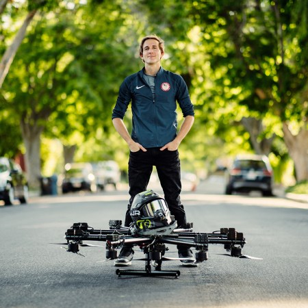 Hunter Kowald standing with hoverboard