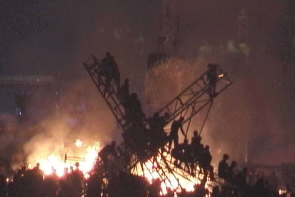 An image of burning stage or lighting rig from Woodstock 99, as shown on a new HBO documentary