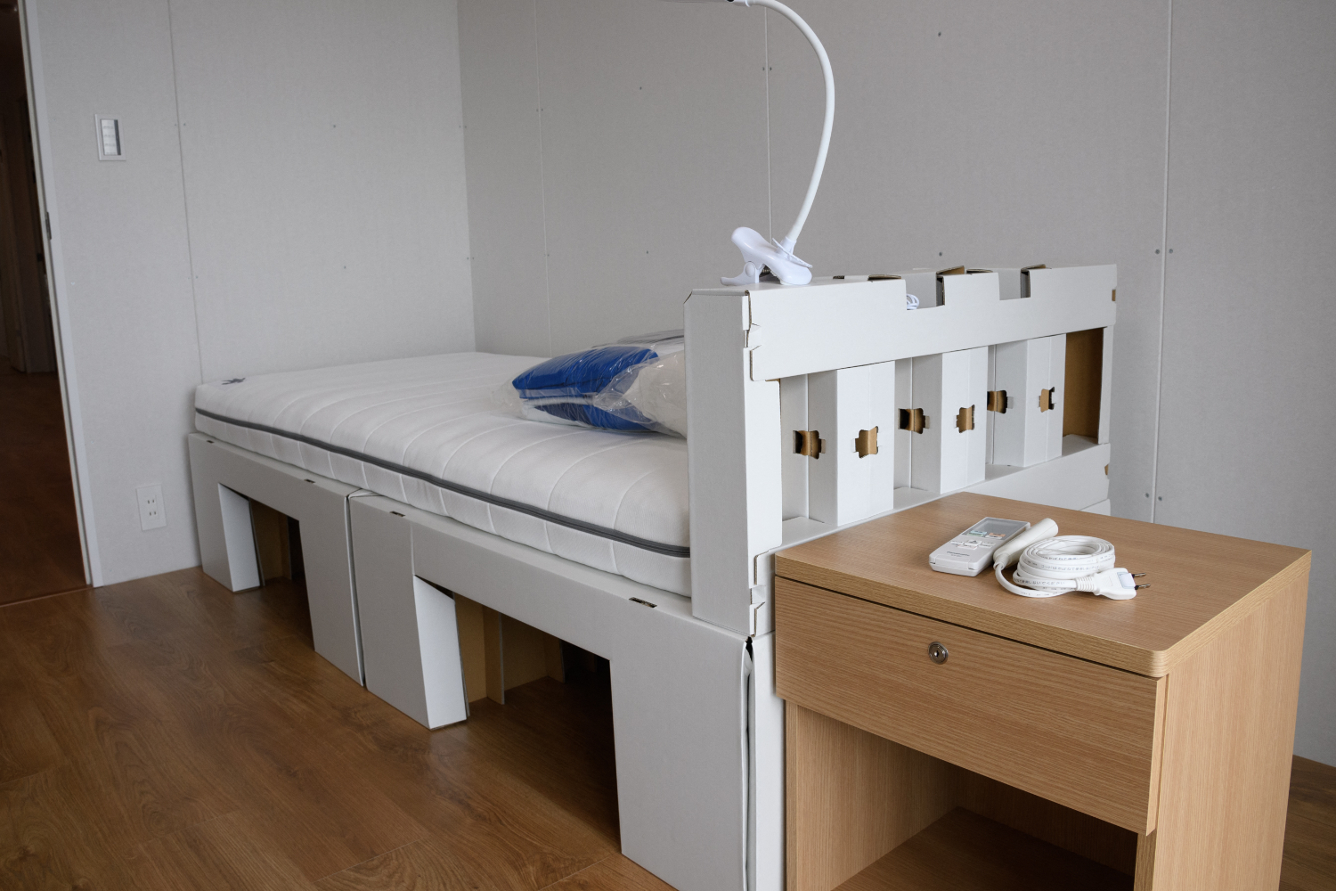 A recyclable cardboard bed and mattress for athletes during a media tour at the Olympic and Paralympic Village for the Tokyo 2020 Games, is seen in the Harumi waterfront district of Tokyo