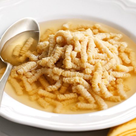 Passatelli served in broth (which is the traditional way).