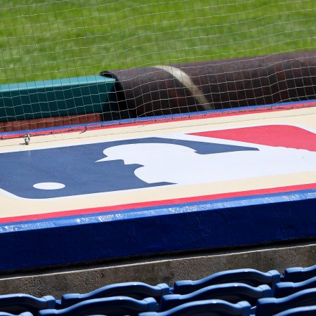 Barstool Sports and MLB are probably not working together, despite recent reports. Pictured here: The Major League Baseball logo on top of a dugout.