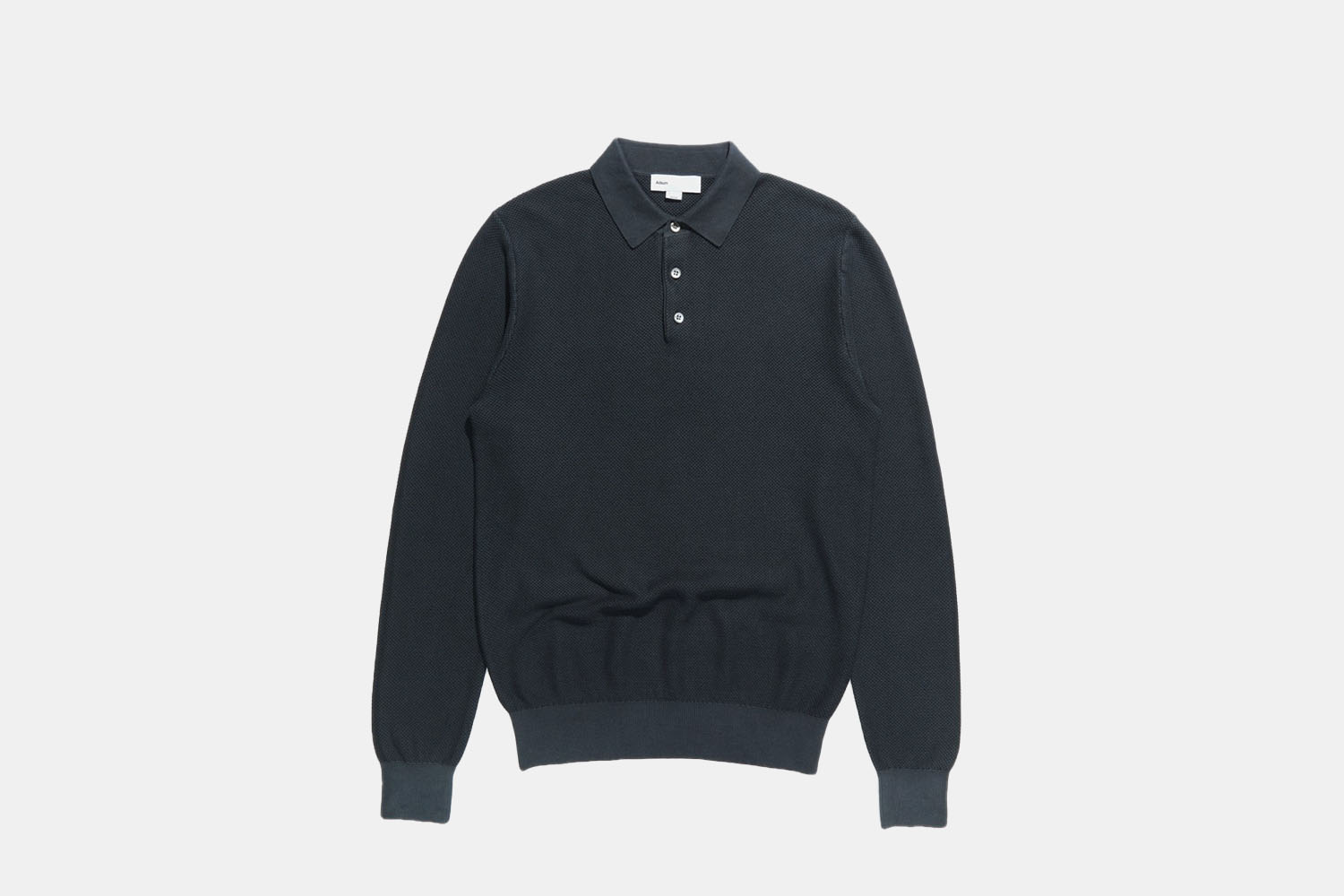 A knit, navy polo.