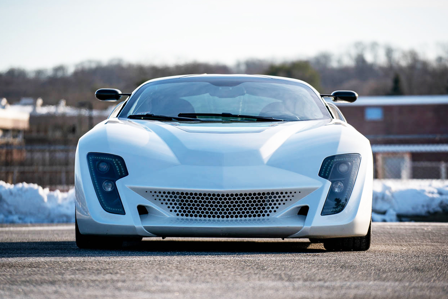 The front end of the Bertone Mantide, a supercar built from a Corvette C6, painted in white instead of the original red