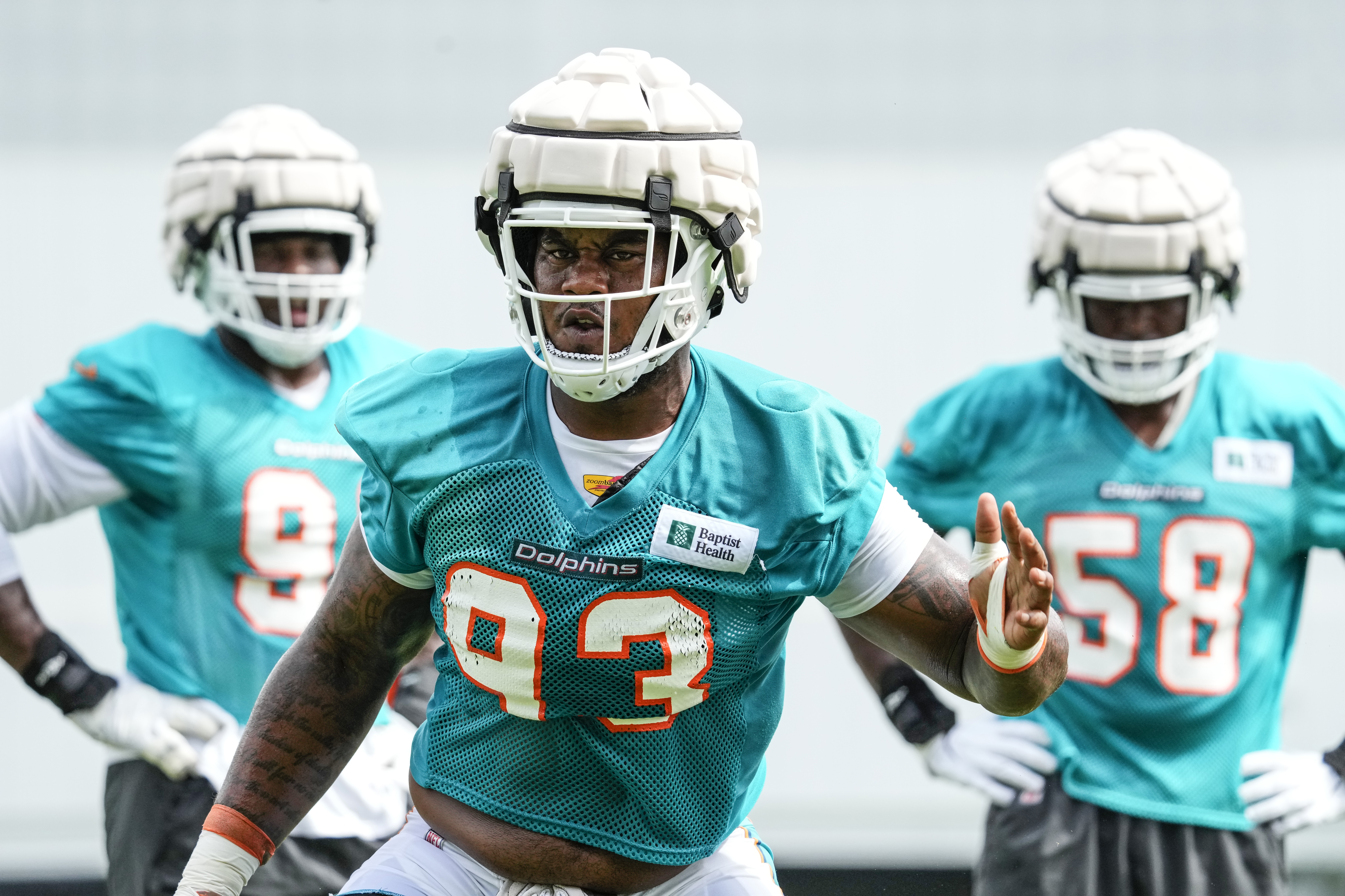 Defensive End Jonathan Ledbetter #93 of the Miami Dolphins wears protective gear during drills in Training Camp at Baptist Health Training Complex on August 02, 2021 in Miami Gardens, Florida. Offfensive and defensive lineman are wearing extra protective gear during Training Camp to help prevent concusssion injuries.