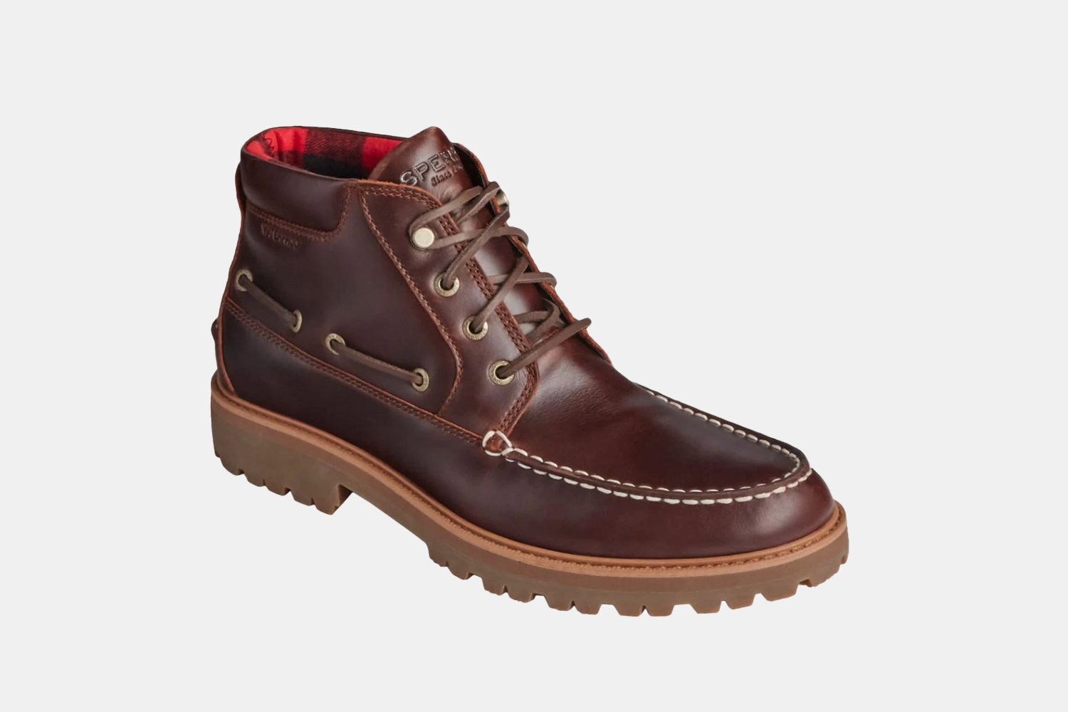 A brown leather boot with a lug sole.