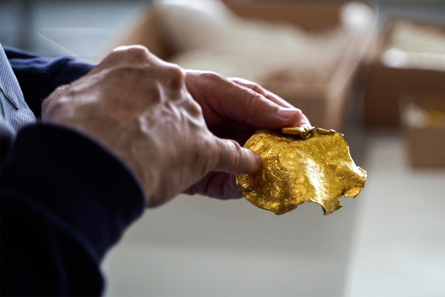 A man holding a piece of Iron Age gold found by Danish rookie treasure hunter Ole Ginnerup Schytz and to be exhibited at the Vejlemuseerne in Denmark