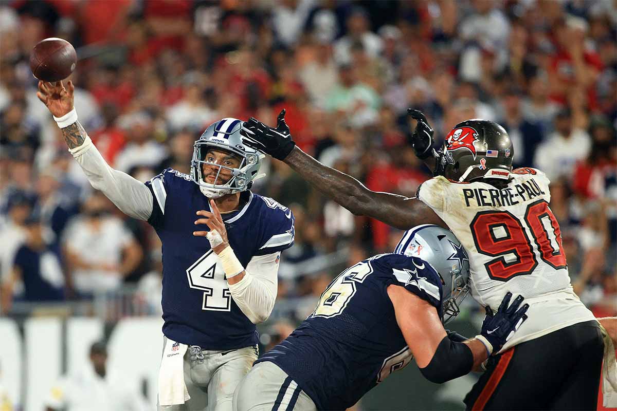 Dak Prescott #4 of the Dallas Cowboys passes while pressured by Jason Pierre-Paul #90 of the Tampa Bay Buccaneers during the third quarter at Raymond James Stadium on September 09, 2021 in Tampa, Florida. Prescott's impressive performance shouldn't be overshadowed by a last-second loss.