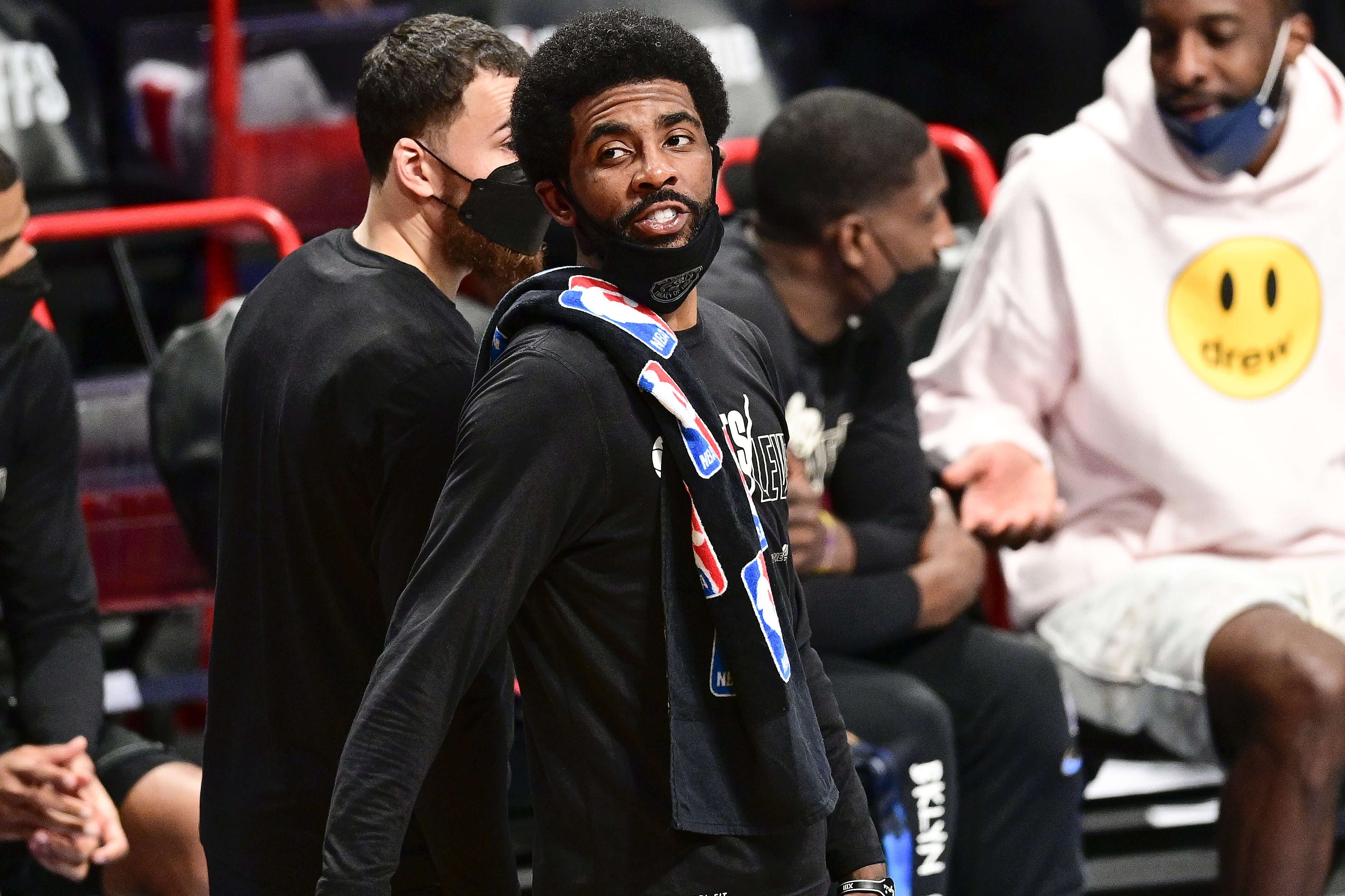 Kyrie Irving reacts to a taunting Boston Celtics fan