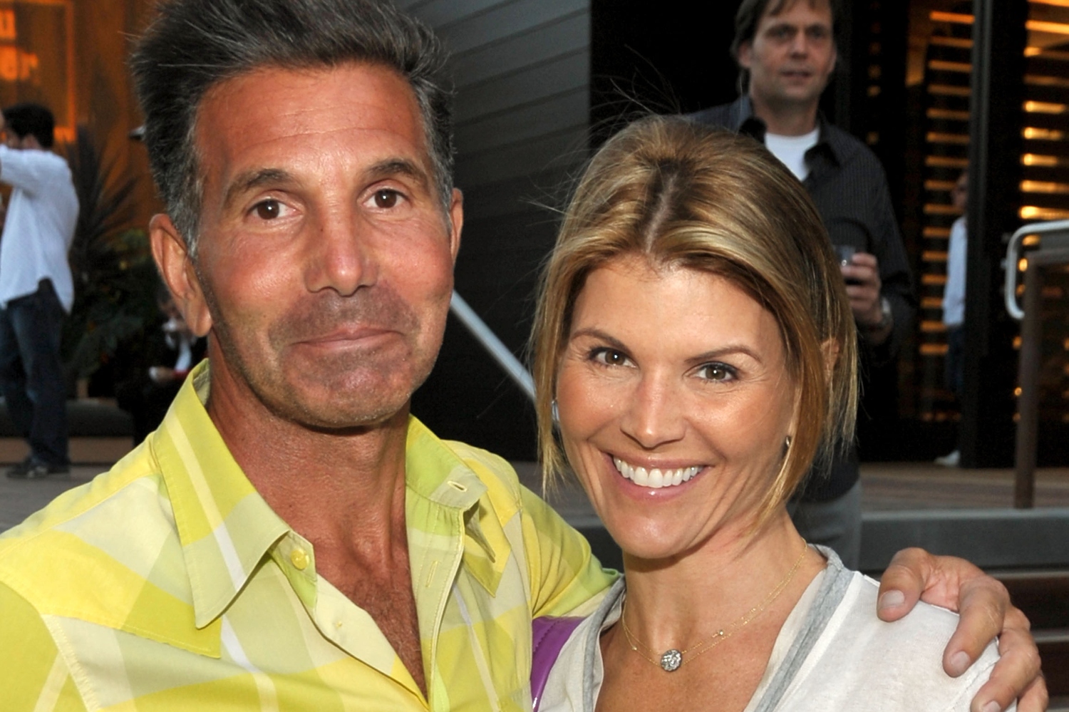 Lori Loughlin and her husband Mossimo Giannulli attend the Malibu Lumber Yard grand opening held at the Malibu Lumber Yard on April 21, 2009 in Malibu, California